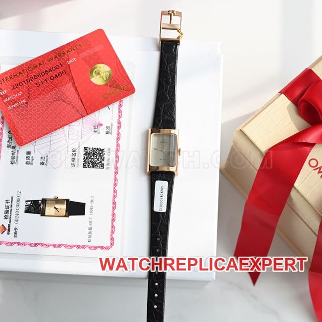 Real-life photo of the front of a top-tier replica Omega De Ville watch with a gray dial, quartz movement, and black leather strap