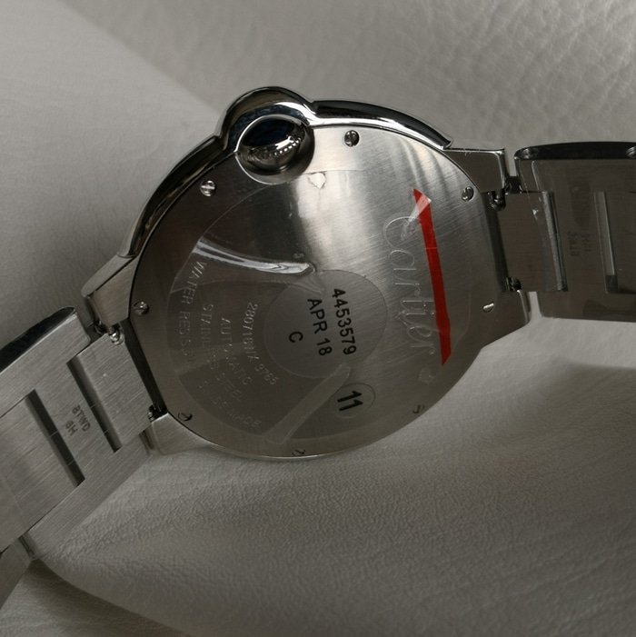 top-tier replica watch Cartier men's blue dial blue balloon series steel bracelet watch side view
