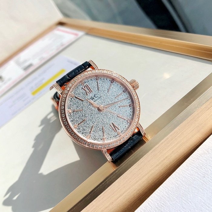 top-tier replica watch IWC women's white dial Portofino mechanical leather strap watch front view