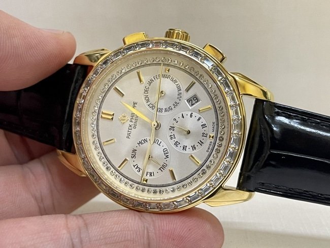 top-tier replica watch Patek Philippe women's white dial black belt complex chronograph function series leather strap watch front view